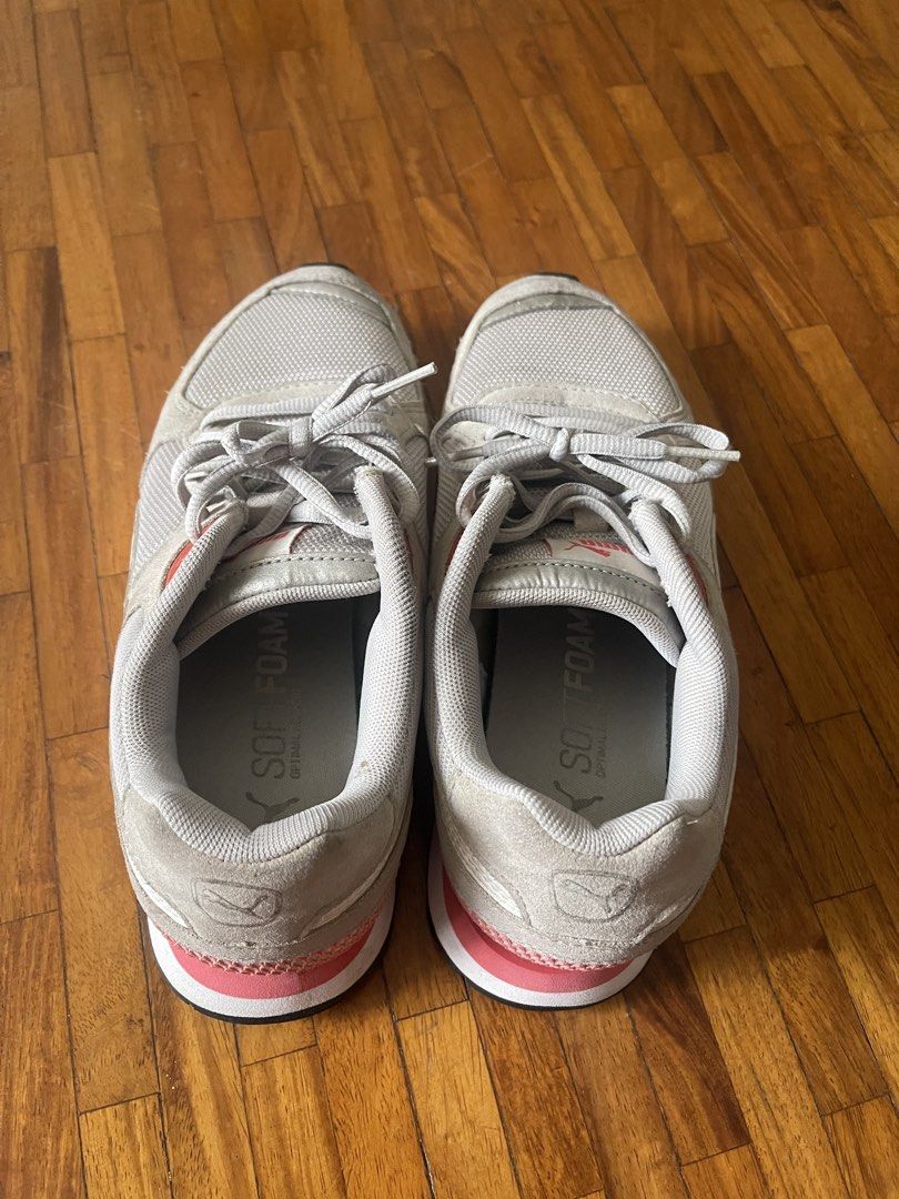 Puma Soft Foam Sneakers Grey Pink White (Category: Sneakers) located in San Juan City. Submitted by rike_ramirez (Listing ID 1464586695, Image 2). Description: US Size 6.5 Original, purchased in Japan. - light gray Puma sneakers - Pink and white accents - Puma branding on tongue and side - Soft Foam insoles for comfort - Lace-up closure - Ideal for casual wear or light exercise - Soles show some wear but retain good grip.
