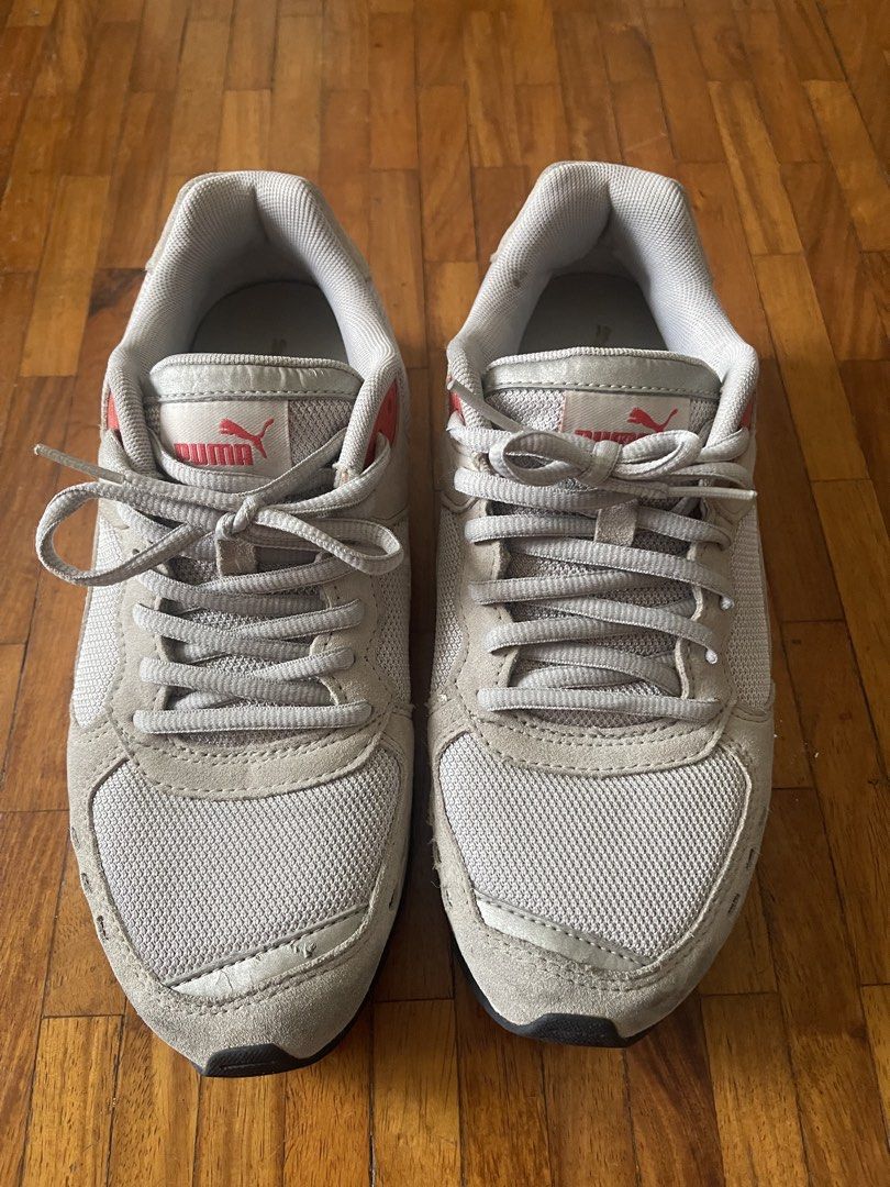 Puma Soft Foam Sneakers Grey Pink White (Category: Sneakers) located in San Juan City. Submitted by rike_ramirez (Listing ID 1464586695, Image 1). Description: US Size 6.5 Original, purchased in Japan. - light gray Puma sneakers - Pink and white accents - Puma branding on tongue and side - Soft Foam insoles for comfort - Lace-up closure - Ideal for casual wear or light exercise - Soles show some wear but retain good grip.