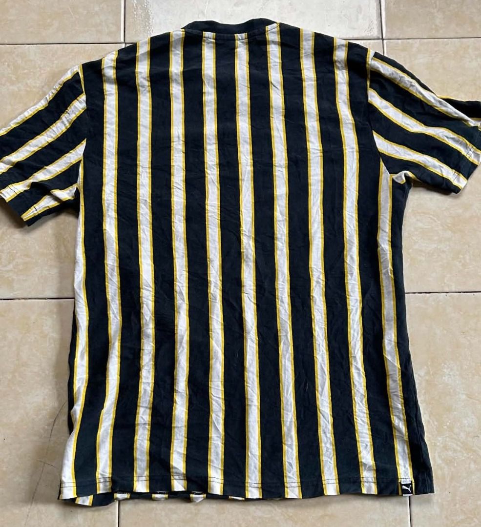 PUMA Downtown Stripe Tee (Category: Tshirts & Polo Shirts ) located in General Santos City (Dadiangas). Submitted by moana_thrifts (Listing ID 1464629407, Image 2). Description: - Brand: Puma - Size: M (Asia fit) - Design: Black, white, and yellow stripes - Features: Large Puma logo graphic on the front - Ideal for: Casual wear - Condition: Please check photos for detailed condition..