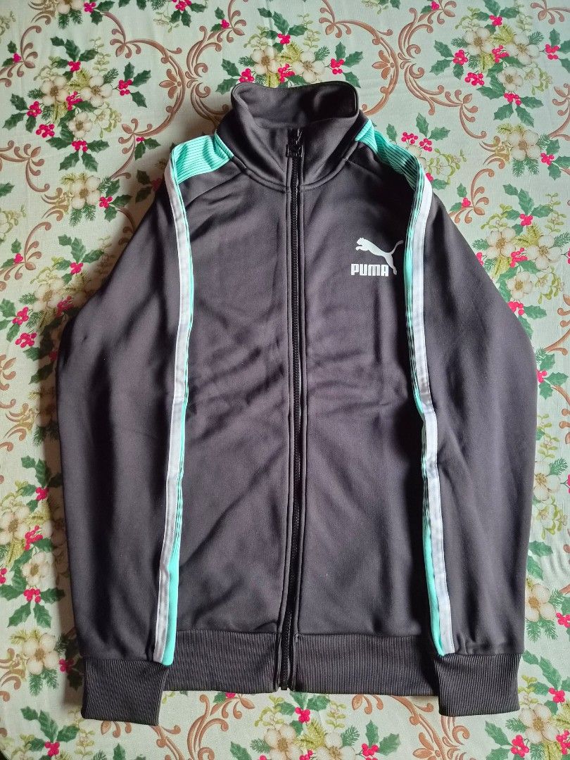 Puma T7 Sport Track Jacket (Category: Coats, Jackets and Outerwear) located in San Fernando. Submitted by bby0818 (Listing ID 1464671403, Image 1). Description: Purchased from PUMA United Kingdom 🇬🇧 101% legit or moneyback guarantee if proven fake Excellent used condition (worn once) Unisex Size: Small - Fits medium frame (W).