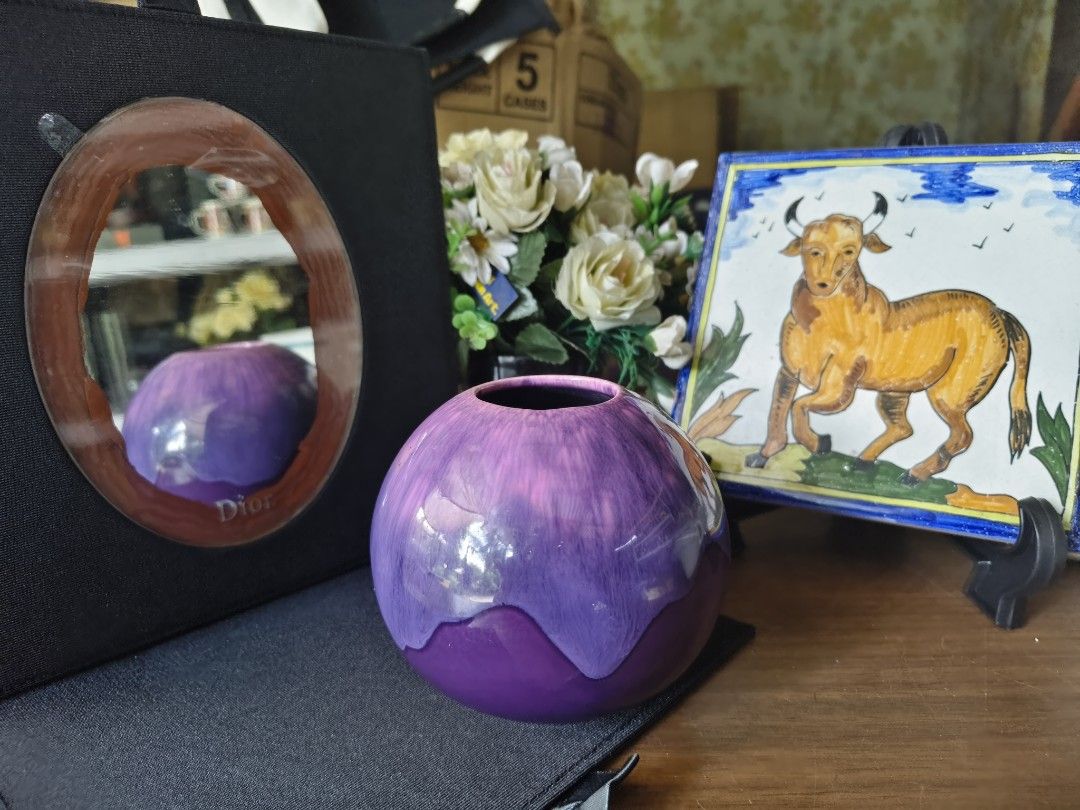 Purple Ceramic Round Vase (Category: Vases & Decorative Bowls) located in Alaminos. Submitted by rarefinds1215 (Listing ID 1464604682, Image 1). Description: - Cute round vase - Glossy purple glaze with a drippy effect - Perfect for small bouquets or standalone decor - Adds a pop of color - Approximately 5 inches tall.