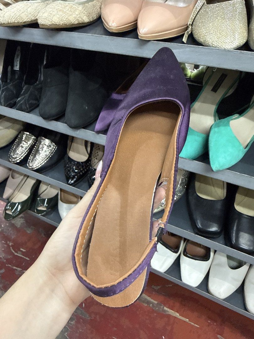 Purple Pointed Toe Slingback Heels Size 38 (Category: Heels) located in Manila. Submitted by fastlion.584bdf (Listing ID 1464735964, Image 2). Description: - Color: Purple with black kitten heel and tan inner lining - Design: Pointed toe and slingback style - Fit: Elastic strap near the heel for easy wear and secure fit - Size: 38 (marked on sole) - Condition: Great find, perfect for work or casual outings.