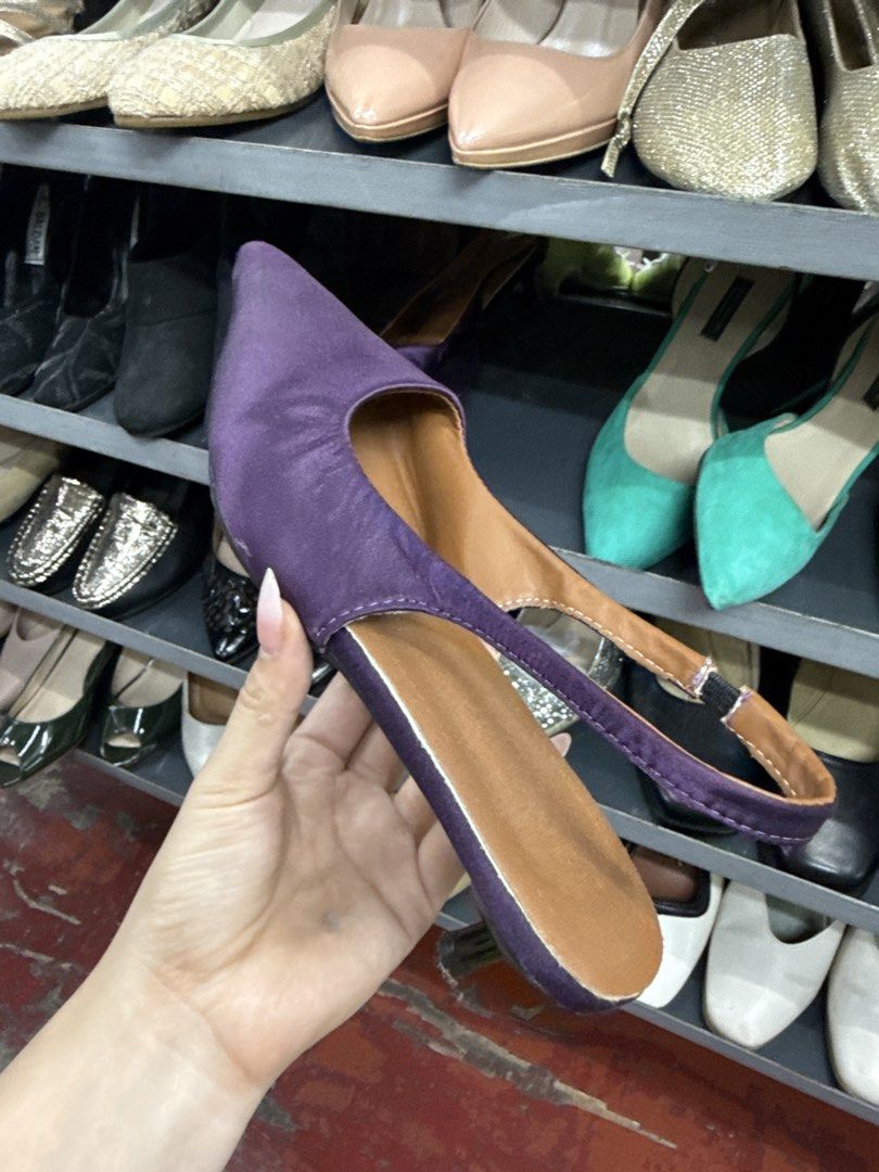 Purple Pointed Toe Slingback Heels Size 38 (Category: Heels) located in Manila. Submitted by fastlion.584bdf (Listing ID 1464735964, Image 1). Description: - Color: Purple with black kitten heel and tan inner lining - Design: Pointed toe and slingback style - Fit: Elastic strap near the heel for easy wear and secure fit - Size: 38 (marked on sole) - Condition: Great find, perfect for work or casual outings.