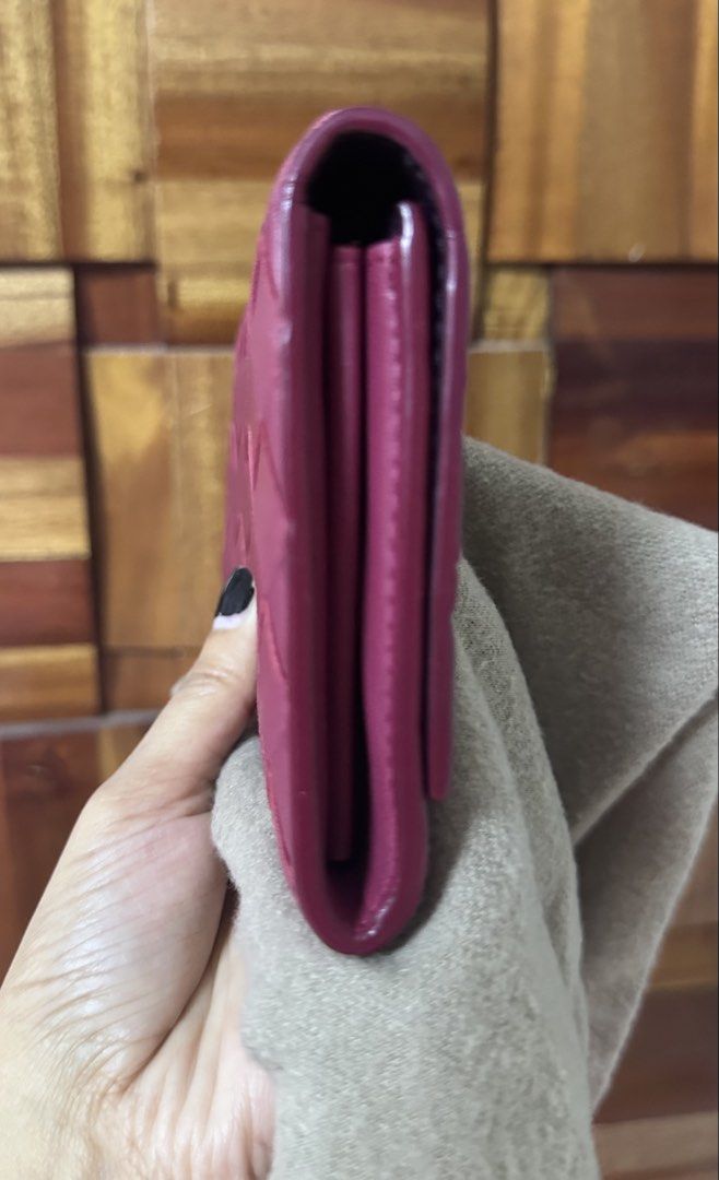 Purple Woven Leather Long Wallet (Category: Luxury Bags & Wallets) located in General Trias. Submitted by mimispreloves (Listing ID 1464604284, Image 3). Description: - Chic purple long wallet - Elegant woven leather detail - Secure snap closure - Interior features multiple card slots - Includes a zippered pocket for coins or small items - Perfect for organizing your daily essentials - Dimensions: Approx. 7.5 inches (length) x 3.5 inches (width).
