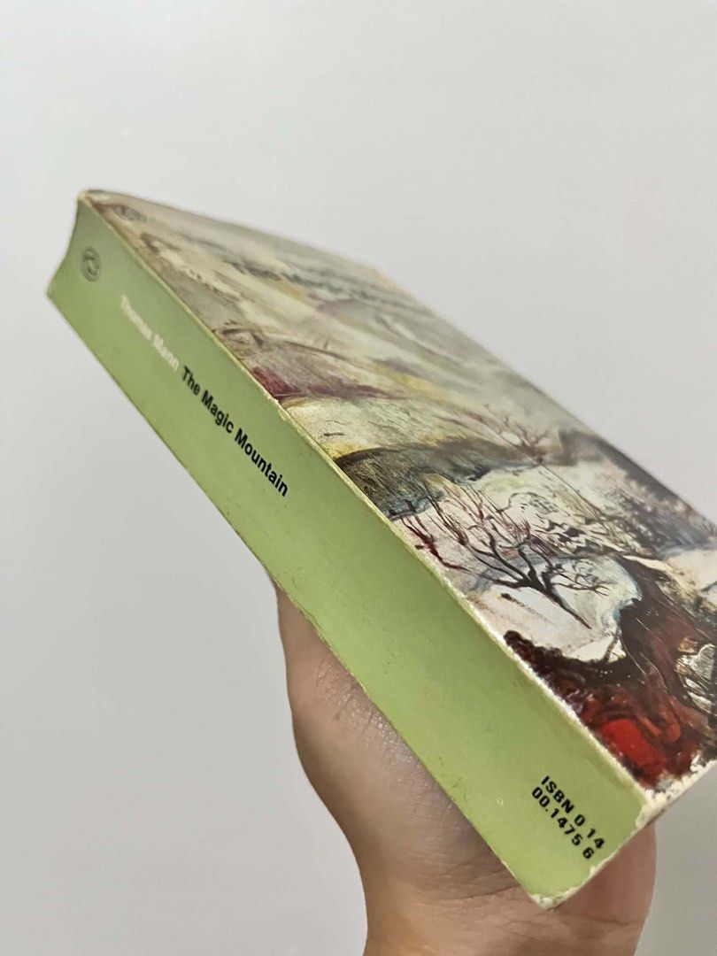 [RARE] The Magic Mountain by Thomas Mann Penguin Modern Classics (Category: Storybooks) located in Manila. Submitted by ohcaptainmycaptain (Listing ID 1464722871, Image 2). Description: MMPB - Title: The Magic Mountain by Thomas Mann - Edition: Penguin Modern Classics paperback - ISBN: 0140014756 - Cover: Features classic artwork - Condition: Vintage copy with heavy tanning and foxing from age, plus creasing along the spine and edges - Perfect fo