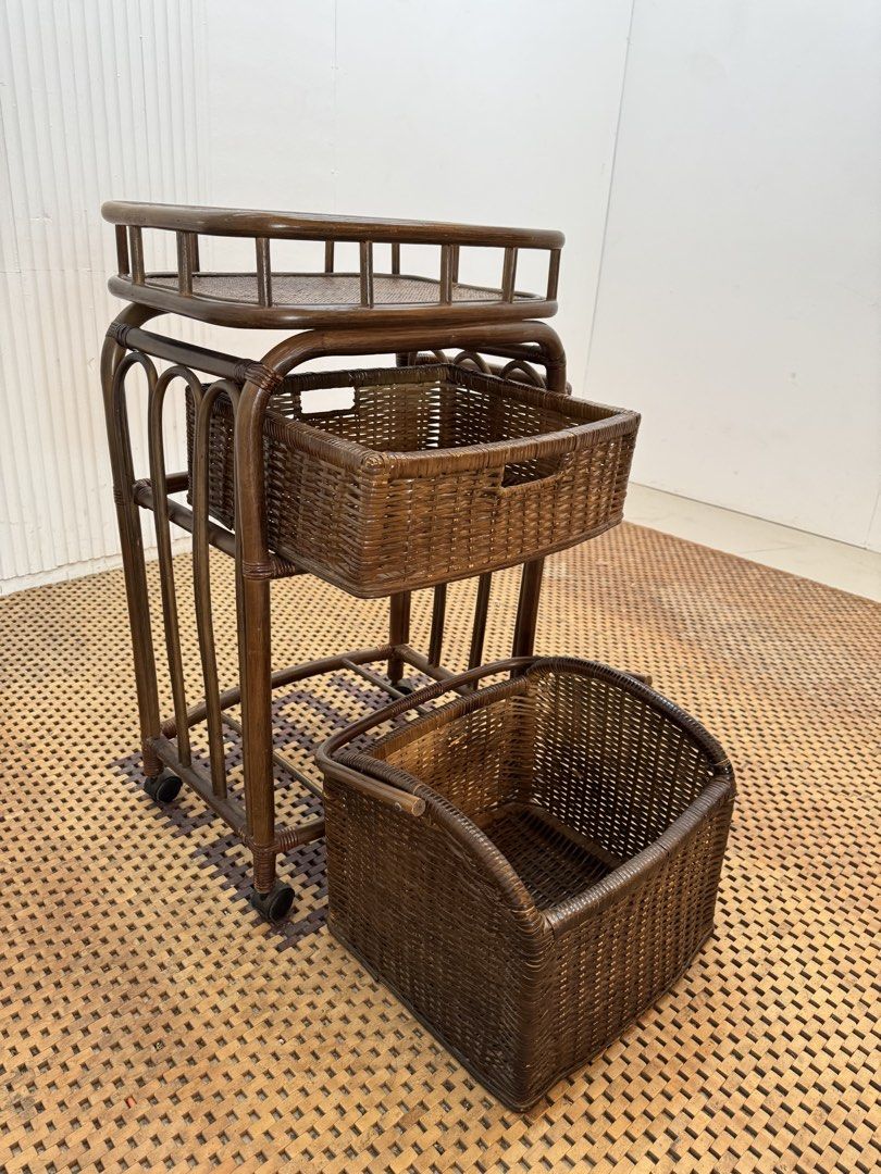 Rattan storage cart (Category: Shelves, Cabinets & Racks) located in Quezon City. Submitted by matetdevis13 (Listing ID 1464747455, Image 3). Description: Vintage Rattan Rolling Storage Cart with 2 Removable Wicker Baskets Price: 3,700 L22 x W14 x H34 In good condition Code JMD15-MJ592 It can also be used as a kitchen cart, bathroom organizer, laundry trolley, or bedside storage cart..
