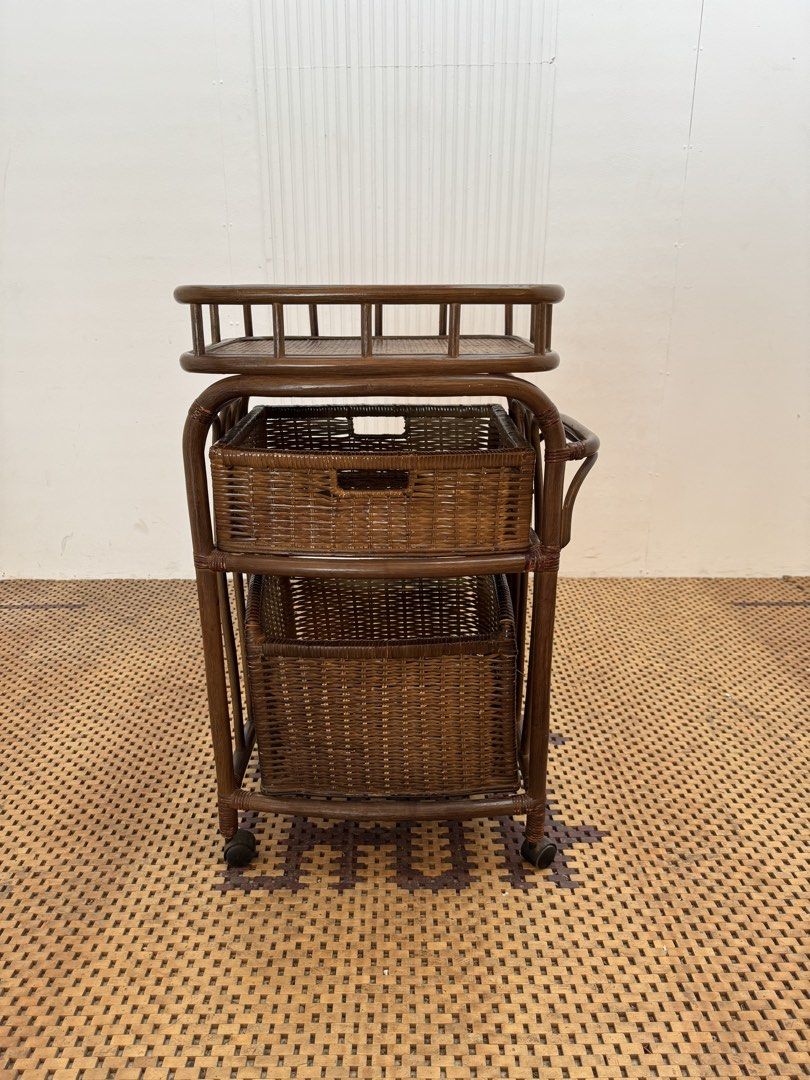 Rattan storage cart (Category: Shelves, Cabinets & Racks) located in Quezon City. Submitted by matetdevis13 (Listing ID 1464747455, Image 1). Description: Vintage Rattan Rolling Storage Cart with 2 Removable Wicker Baskets Price: 3,700 L22 x W14 x H34 In good condition Code JMD15-MJ592 It can also be used as a kitchen cart, bathroom organizer, laundry trolley, or bedside storage cart..