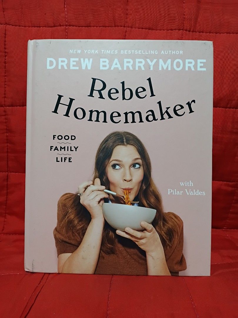 Rebel Homemaker Cookbook by Drew Barrymore (Category: Storybooks) located in Manila. Submitted by krishna_ayanami (Listing ID 1464726872, Image 1). Description: - Title: Rebel Homemaker by Drew Barrymore with Pilar Valdes - Format: Hardcover edition published by Dutton - Contents: Easy-to-follow recipes for breakfast, lunch, dinner, sides, and salads - Visuals: Filled with gorgeous food photography throughout - Condition: Great addition to any ki