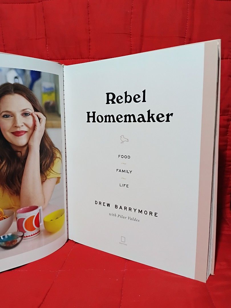 Rebel Homemaker Cookbook by Drew Barrymore (Category: Storybooks) located in Manila. Submitted by krishna_ayanami (Listing ID 1464726872, Image 2). Description: - Title: Rebel Homemaker by Drew Barrymore with Pilar Valdes - Format: Hardcover edition published by Dutton - Contents: Easy-to-follow recipes for breakfast, lunch, dinner, sides, and salads - Visuals: Filled with gorgeous food photography throughout - Condition: Great addition to any ki