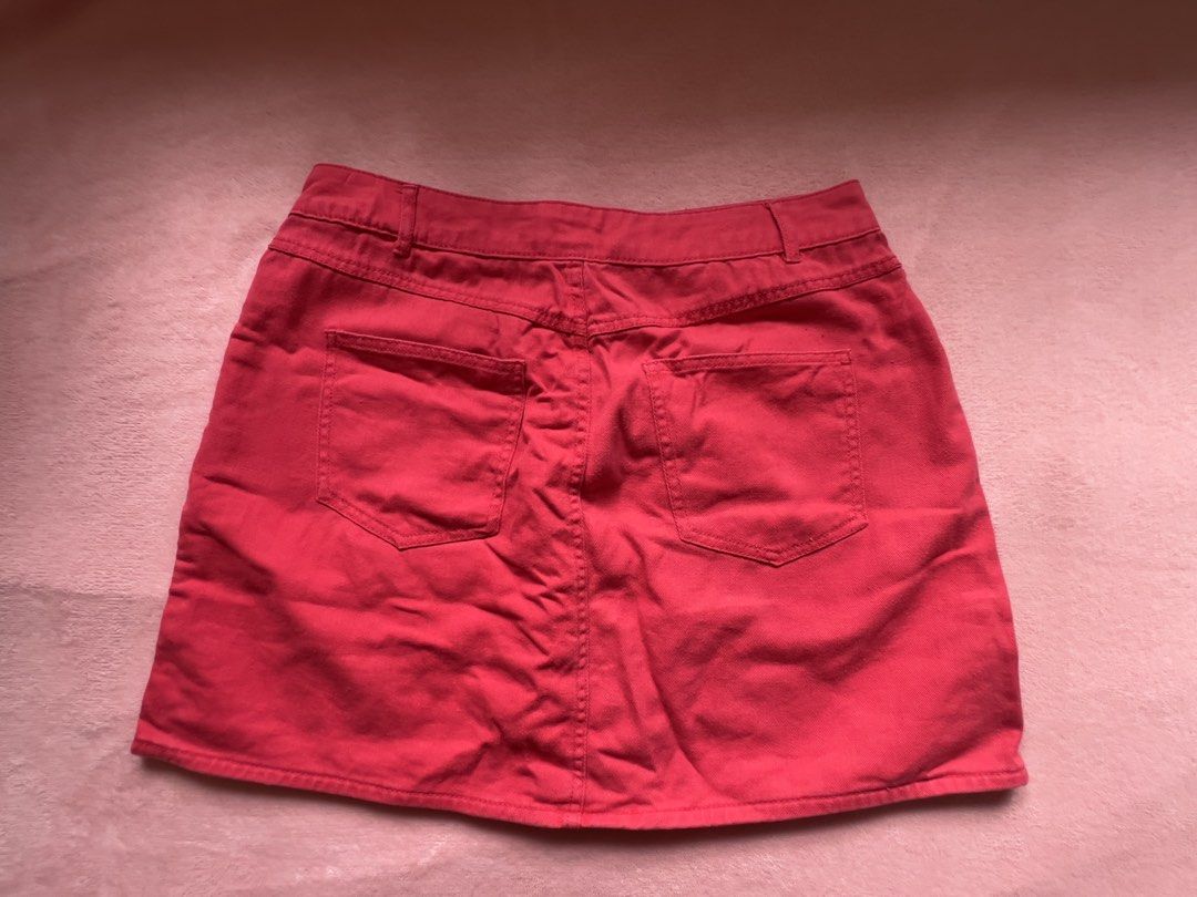 Red Button-Up Denim Mini Skirt (Category: Skirts) located in Batangas. Submitted by alaisaampa7513 (Listing ID 1464570854, Image 2). Description: - Red denim mini skirt from Terra Nova - Button-up front - Classic five-pocket design - Estimated size XL - Versatile for casual wear and easy to style.