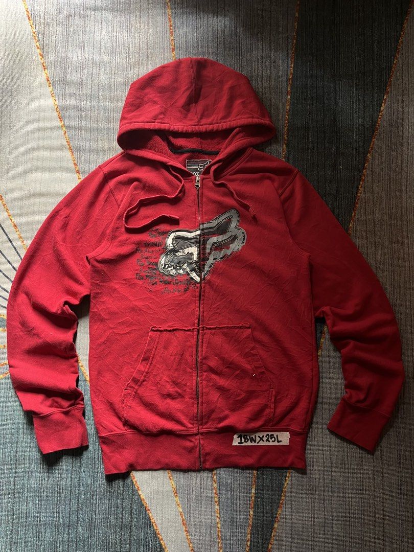 Red Fox Racing Zip-Up Hoodie (Category: Coats, Jackets and Outerwear) located in Puerto Princesa. Submitted by dijaydj28 (Listing ID 1464588638, Image 1). Description: - Classic red Fox Racing zip-up hoodie - Features iconic Fox head logo and graphic text on front - Full zip closure - Front pockets - Hood drawstrings intact - Minor signs of wear (small snag near shoulder) - Perfect for casual wear.