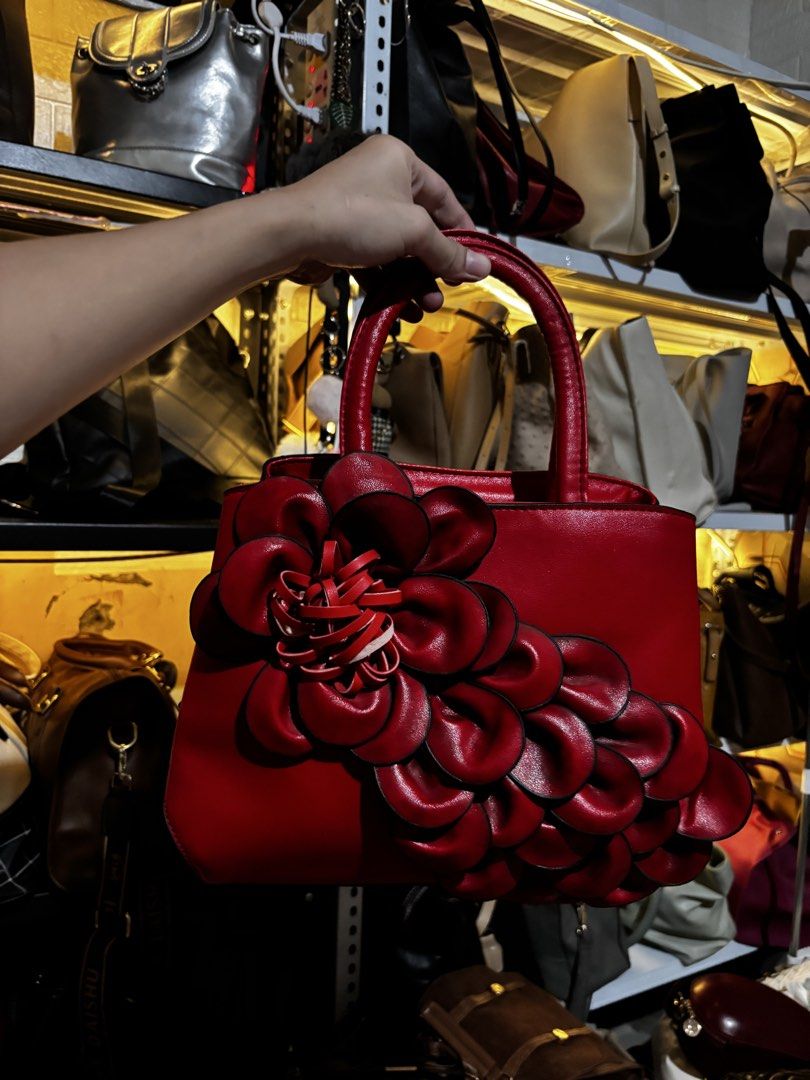 Red Handbag with Flower Accent (Category: Shoulder Bags) located in Caloocan City. Submitted by _avionlineshop24 (Listing ID 1464581459, Image 1). Description: Small size No sling ( sling slot ready) preloved no inclusion .