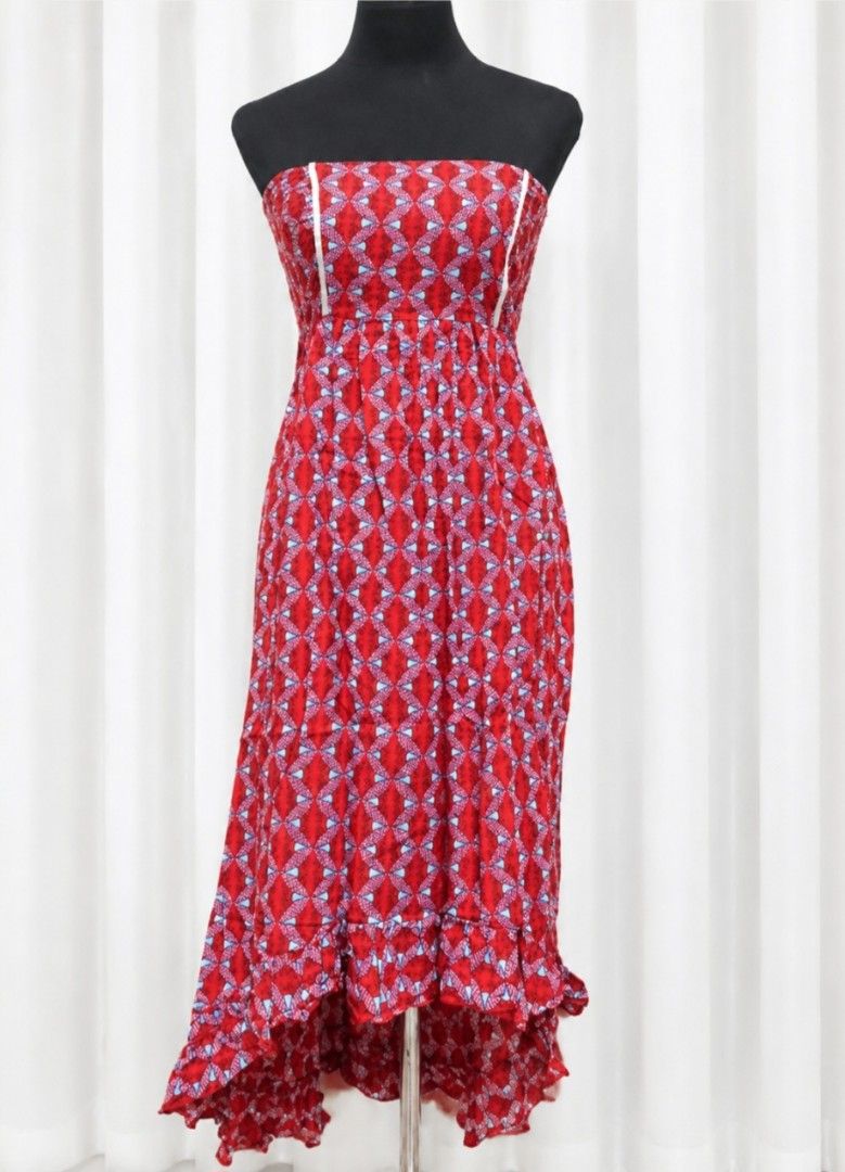 Red patterned strapless high-low midi dress (Category: Dresses) located in Pateros City. Submitted by myshahnmia (Listing ID 1464749221, Image 1). Description: - Style: Red strapless dress with blue and white geometric pattern - Design: Straight neckline with white vertical piping and a high-low ruffled hem - Fabric: Lightweight and comfortable, perfect for warm weather - Versatility: Great for summer outings, beach days, or resort vacations - Co