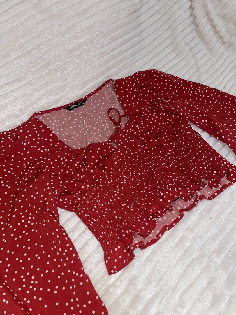 Red Polka Dot Long Sleeve (Category: Longsleeves) located in Manila. Submitted by rare.yurichi (Listing ID 1464737569, Image 1). Description: Features a red and white polka dot print, flattering sweetheart neckline with front tie detailing, elastic shirred/smocked waist, and long slightly puffed sleeves..