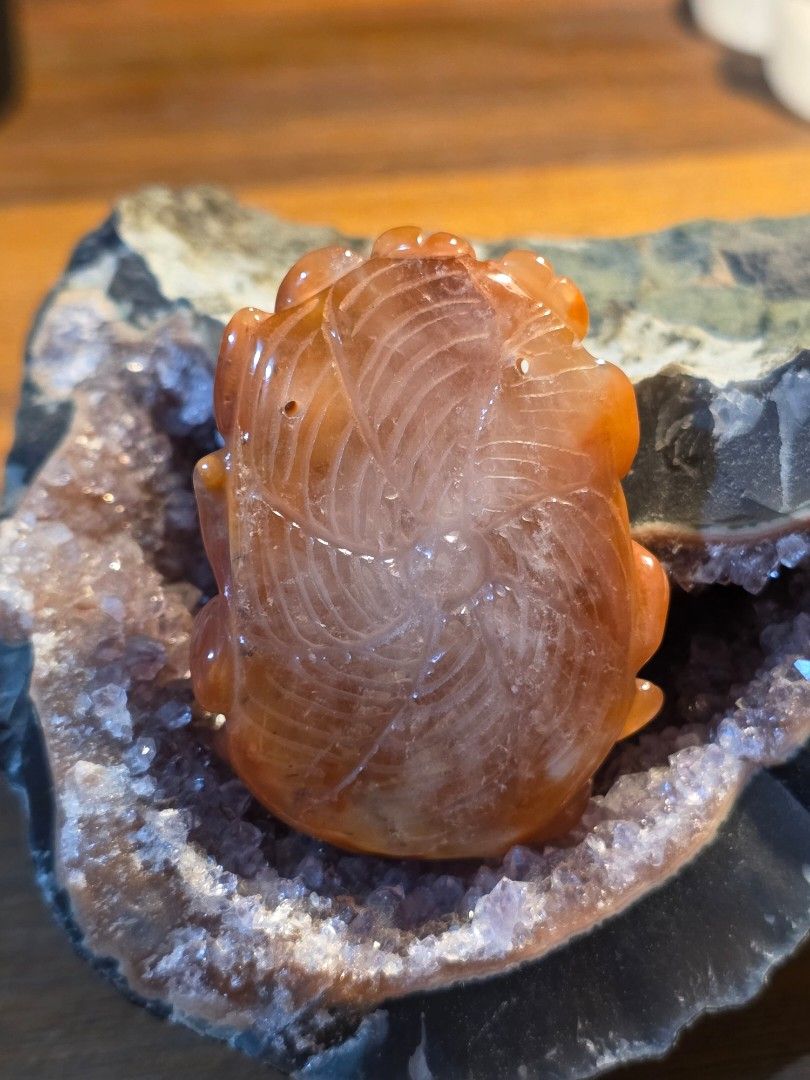 Red Quartz Crystal Carved Nine-Tailed Fox Pendant (Category: Charms) located in Manila. Submitted by alyayeah (Listing ID 1464697340, Image 2). Description: - Material: Rich red quartz stone with warm orange and amber tones - Design: Intricately carved nine-tailed fox with a flower and patterned back grooves - Size: Approximately 5 cm in length, big size! - Finish: Smooth and polished -Features a holes near the top for a cord or chain -Statement 
