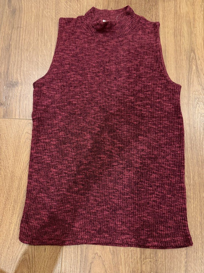 Red sleeveless turtleneck (Category: Sleeveless) located in Paranaque City. Submitted by bbyooodaa (Listing ID 1464643910, Image 1). Description: Dark red sleeveless turtleneck top .