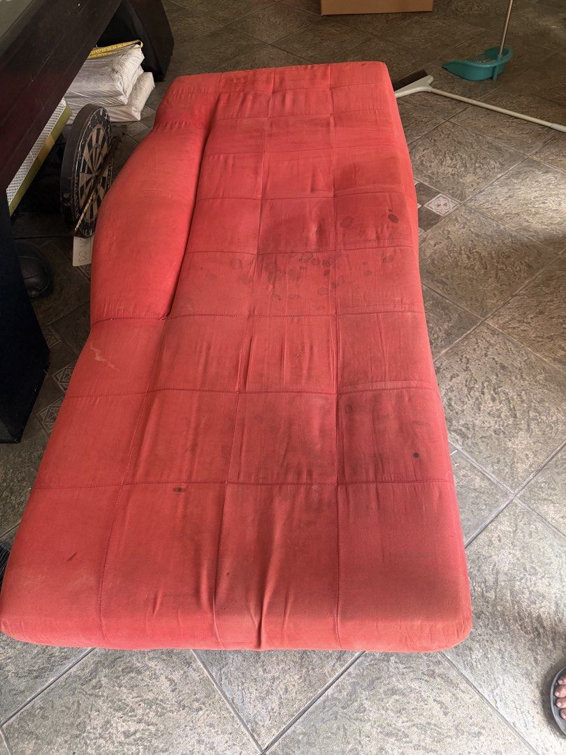 Single bed/Lounge Sofa Bed (Category: Sofas) located in Mandaluyong City. Submitted by alcmsnts (Listing ID 1464705144, Image 2). Description: Red tufted fabric chaise lounge with one armrest that converts into a flat bed. Features stylish chrome metal legs. Has some visible surface stains and needs a good cleaning, but otherwise fully functional. Great space-saver for any room! Sf shouldered by the buyer MOP: GCash or BPI bank transfer.