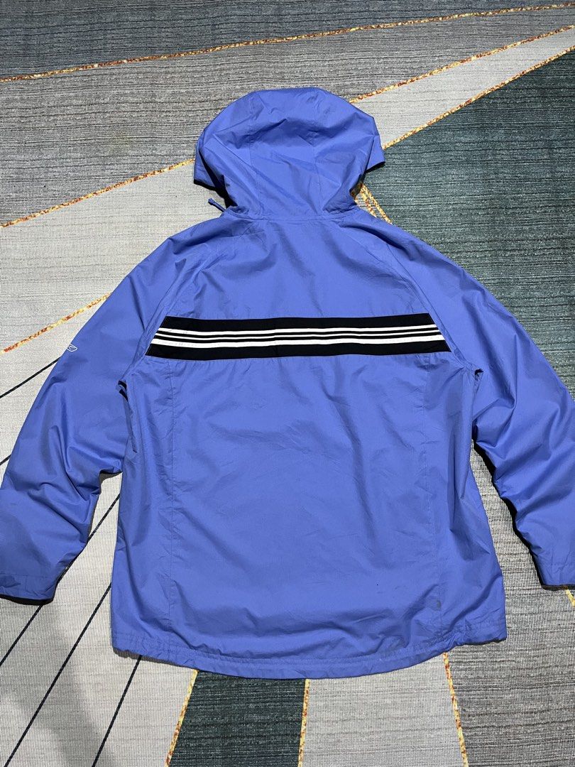 Reebok Blue Windbreaker Jacket with Black and White Stripes (Category: Coats, Jackets and Outerwear) located in Puerto Princesa. Submitted by dijaydj28 (Listing ID 1464590413, Image 3). Description: - Cool blue Reebok windbreaker jacket - Features a hood and half-zip closure - Stylish black stripe with white accents across chest and back - Ideal for casual outings and light outdoor activities - Lightweight and packable for on-the-go convenience.