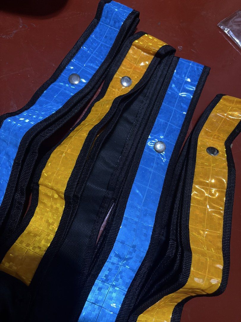 Reflective Safety Bands High Visibility Straps (Category: Vests) located in Manila. Submitted by finderskeepersmnl_092026 (Listing ID 1464715540, Image 2). Description: - Set of 4 reflective safety vest in vibrant blue and yellow - Durable black fabric trim along the edges for extra durability - Secure metal snap buttons for easy adjustment and fastening - Distinct grid pattern on the high-visibility reflective material - Ideal for night running,