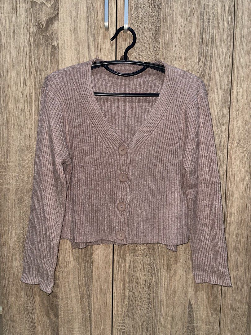 Ribbed Knit Button-Up Cardigan (Category: Coats, Jackets and Outerwear) located in Manila. Submitted by preloveditems_jem (Listing ID 1464667335, Image 1). Description: Cute ribbed knit V-neck cardigan with button-up front and flared. Perfect for layering or wearing solo!.