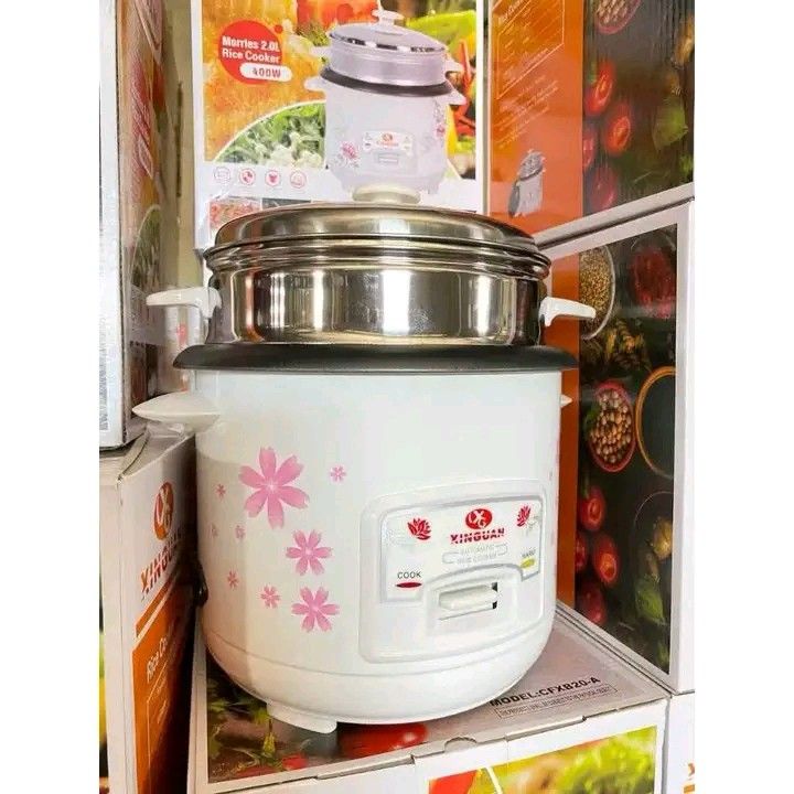 RICE COOKER 2L (Category: Cookers) located in Manila. Submitted by berdenmarl01688 (Listing ID 1464748067, Image 1). Description: - Color/Design: White with a charming pink floral cherry blossom pattern - Includes: Stainless steel lid and top steaming tier - Operation: Standard single-button switch for easy cook and warm modes - Condition: Brand new in original box - Perfect for small spaces, dorms, or as a gift - Meetup or shipping options avail