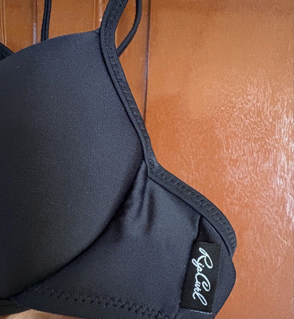 Rip Curl Black Bikini Top (Category: Bikinis & Swimsuits) located in Lucban. Submitted by paulapicks (Listing ID 1464633182, Image 2). Description: - Brand: Rip Curl - Color: Black - Style: Bikini Top - Features: Tie front, adjustable straps, padded cups - Occasion: Beach or pool - Benefits: Comfortable and stylish.