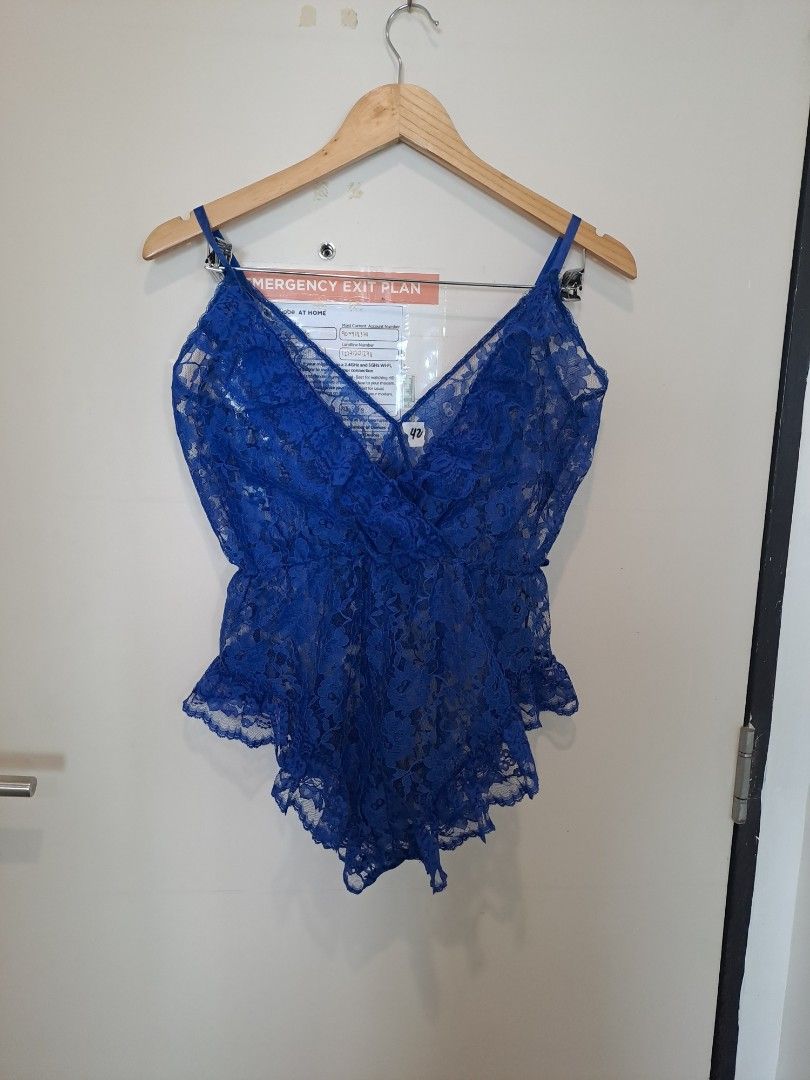 Royal blue lingerie (Category: Undergarments & Loungewear) located in Manila. Submitted by joanbalde39643 (Listing ID 1464673093, Image 1). Description: The item in the image is a royal blue scallop floral lace teddy bodysuit, featuring sheer all-over lace patterning, a plunge V-neckline, thin camisole straps, and ruffled flutter trim along the hemline..
