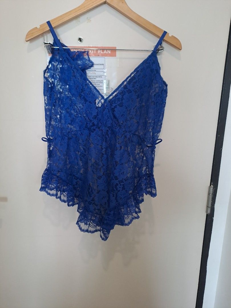 Royal blue lingerie (Category: Undergarments & Loungewear) located in Manila. Submitted by joanbalde39643 (Listing ID 1464673093, Image 2). Description: The item in the image is a royal blue scallop floral lace teddy bodysuit, featuring sheer all-over lace patterning, a plunge V-neckline, thin camisole straps, and ruffled flutter trim along the hemline..