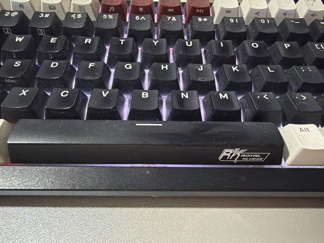 Royal Kludge Mechanical Keyboard RK Royal Kludge (Category: Computer Keyboard) located in Manila. Submitted by miminisam (Listing ID 1464713678, Image 2). Description: - Layout: Full-sized keyboard with separate numeric keypad, function row, and standard QWERTY layout - Aesthetics: Stylish black, white, and maroon colorway with customizable RGB backlighting - Features: Distinct branding on the spacebar - Condition: Working perfectly with minor du