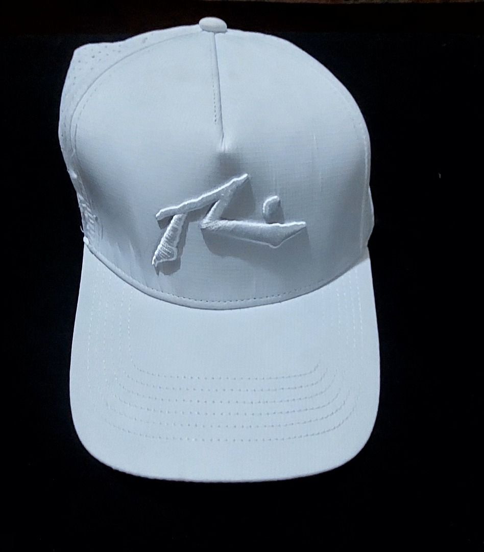 Rusty Surfboard Triple White Cap (Category: Caps & Hats) located in Legazpi City. Submitted by street_uniform (Listing ID 1464741023, Image 1). Description: - Brand/Model: Rusty Anchorman Cap (Model 310UE) - Color: White with embroidered logo on the front - Fit: Adjustable snapback closure - Material: 80% polyester, 20% cotton - Features: Perforated panels for breathability - Condition: Clean and ready to wear.