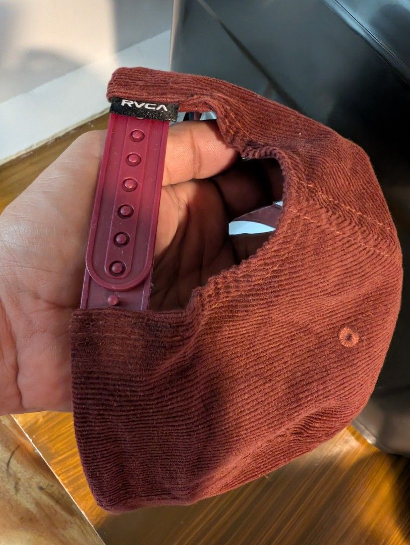 RVCA Badge Snapback (Good as new) (Category: Caps & Hats) located in Naga. Submitted by kenshin78 (Listing ID 1464729776, Image 3). Description: - Brand: RVCA - Material: Brown and white corduroy fabric - Design: Structured crown, flat brim, and oval embroidered logo patch on the front - Closure: Adjustable plastic snapback with a small logo tab - Condition: good as new / Excellent quality - Perfect for daily streetwear and casual outfits.