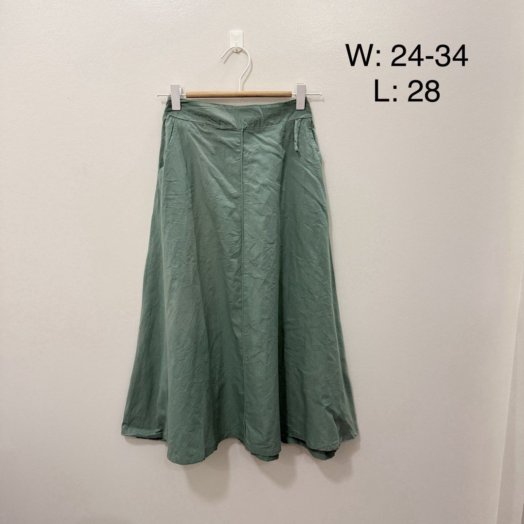 Sage Green A-Line Midi Skirt (Category: Skirts) located in Rodriguez. Submitted by jrms23 (Listing ID 1464685558, Image 1). Description: - Sage green midi skirt - Flattering A-line cut - Convenient side pockets - Comfortable elastic waistband (fits 24-34 inches) - Length: 28 inches - Perfect for casual or dressy looks.