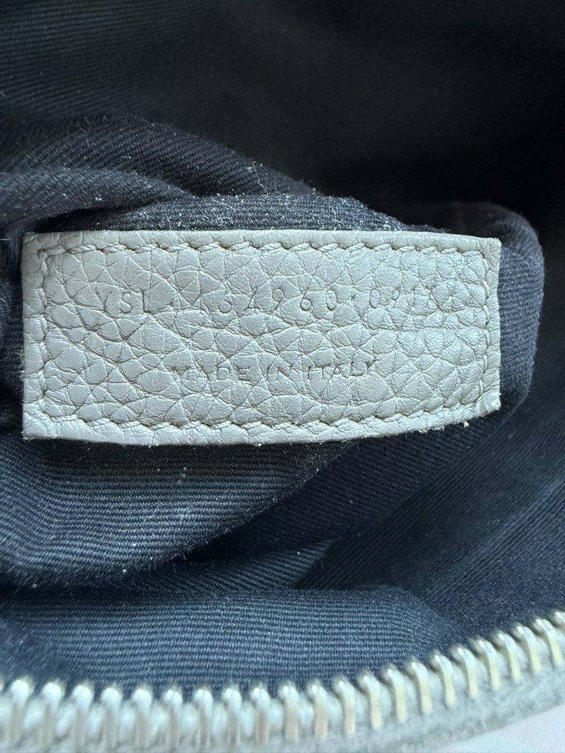 Saint Laurent Sac De Jour Bag Grey (Category: Luxury Bags & Wallets) located in Baguio. Submitted by reimaginedbags (Listing ID 1464716886, Image 2). Description: - Brand: Saint Laurent (YSL) - Model: Sac De Jour - Material: Premium textured grey leather - Hardware: Silver-tone with front logo stamp - Handles: Double top handles - Includes: Matching padlock and keys in a leather clochette - Interior: Fabric lining with a convenient zipped pouch -