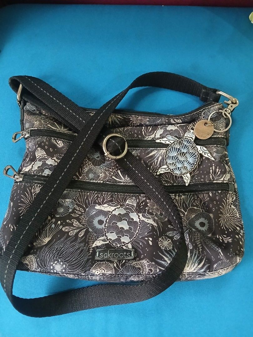 Sakroots Crossbody Bag (Category: Cross-body Bags) located in Quezon City. Submitted by goldenearth_14ecb6 (Listing ID 1460982739, Image 3). Description: - Stylish Sakroots crossbody bag with a vibrant print. - Multiple pockets inside for excellent organization. - Features a convenient zip pocket on the back.and front - Adjustable strap for a comfortable fit. - in good condition - perfect for everyday use.