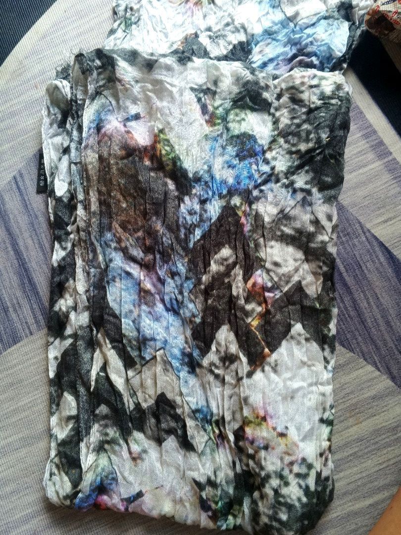 Sandro Galaxy Geo Print SCARF (Category: Luxury Accessories) located in Manila. Submitted by icamalicdem29 (Listing ID 1464609031, Image 1). Description: abstract floral crinkle-effect scarf featuring a mixed collage pattern of black, white, blue, and earth tones.• Composition: As shown on the fabric label, it is made of 100% Viscose (Viscosa). • Texture: It has a crinkled, gauzy texture with a lightly frayed edge finish, making it a highly breat