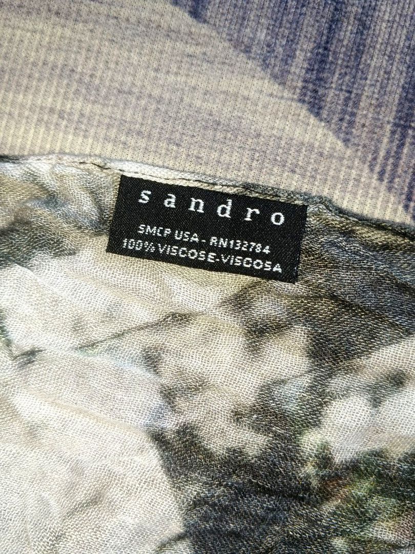 Sandro Galaxy Geo Print SCARF (Category: Luxury Accessories) located in Manila. Submitted by icamalicdem29 (Listing ID 1464609031, Image 2). Description: abstract floral crinkle-effect scarf featuring a mixed collage pattern of black, white, blue, and earth tones.• Composition: As shown on the fabric label, it is made of 100% Viscose (Viscosa). • Texture: It has a crinkled, gauzy texture with a lightly frayed edge finish, making it a highly breat