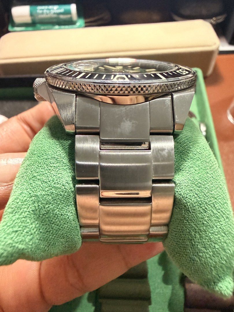 Seiko Prospex King Samurai Green Dial Diver Watch (Category: Men's Watches) located in San Juan City. Submitted by zenrabbit.6105c7 (Listing ID 1464691956, Image 3). Description: - Model: Automatic Dive Watch - Dial: Green textured dial with date window at 3 o'clock - Movement: Automatic - Water Resistance: 200m - Case & Bracelet: Stainless steel with minor hairline scratches from normal wear; screw-down crown at 4 o'clock - Bezel: Rotating black