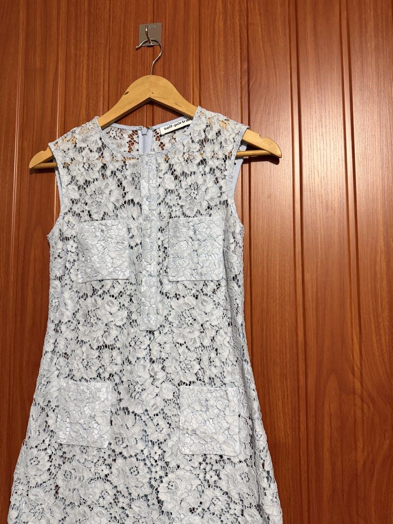 Self-Portrait Blue Fine Lace Mini Dress (Category: Dresses) located in Manila. Submitted by tlfph (Listing ID 1464708486, Image 2). Description: - Brand: Self-Portrait - Color: Classic Blue - Material: Fully patterned fine lace construction - Design: Sleeveless with front pockets, button-style placket, and scalloped hem - Closure: Convenient back neck zipper - Length: Mini / classic silhouette - Condition: Excellent, buyer-friendly deal!.