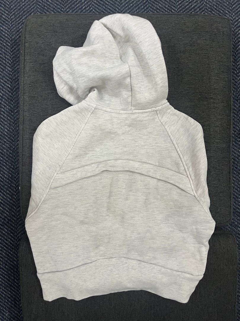 Shein Light Grey Zip-Up Cropped Hoodie (Category: Coats, Jackets and Outerwear) located in Makati City. Submitted by samsafsav (Listing ID 1464608264, Image 2). Description: Fits XS to S Has stains on the elbow and wrist areas of the sleeve RFS: Decluttering.