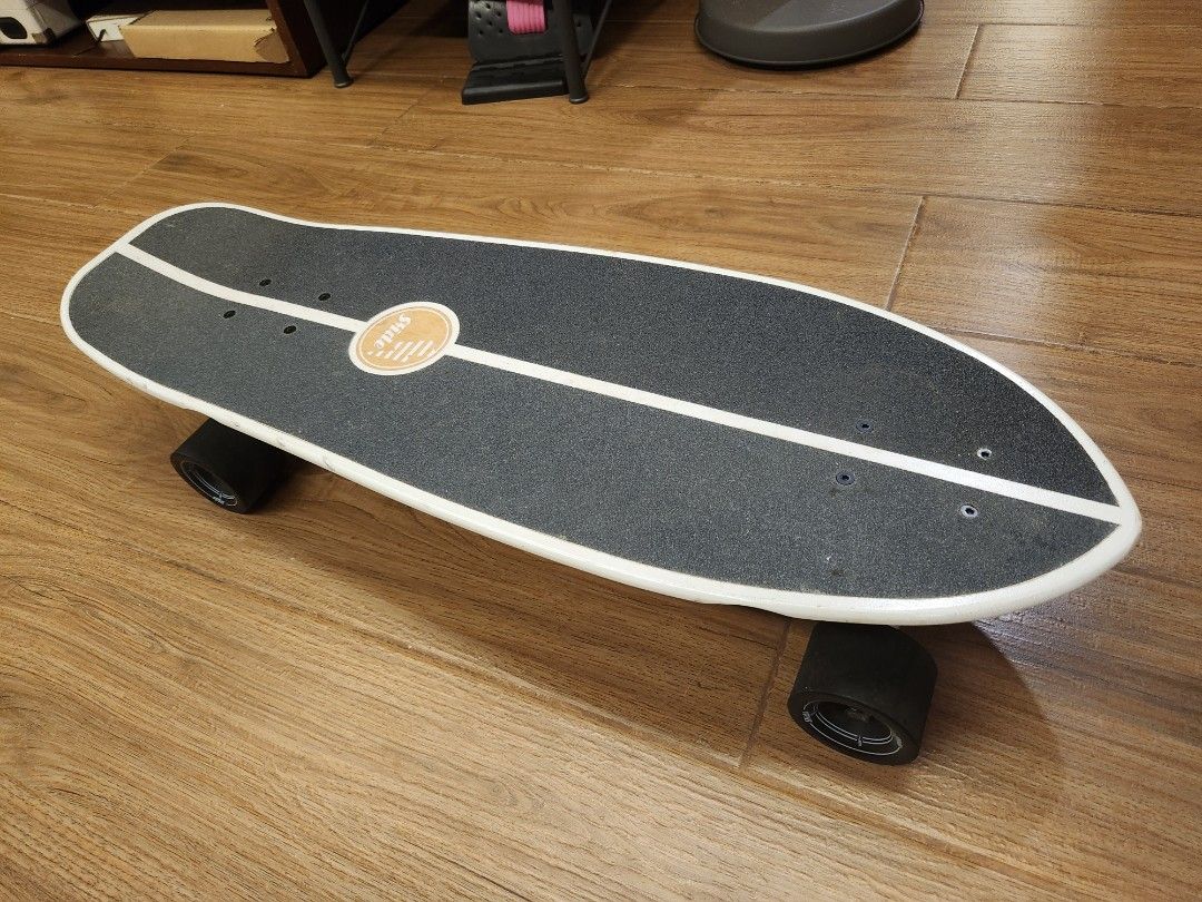 Slide Surfskate Board (Category: Skates, Rollerblades & Scooters) located in Caloocan City. Submitted by noblestorm_c6463a (Listing ID 1464749797, Image 1). Description: - Brand: Slide surfskate - Deck: Black grip tape with a white center stripe and a red-tipped splatter paint design underneath - Wheels: Black with Slide branding - Condition: Minor scuffs and scrapes on the tail edge from normal riding, trucks and wheels roll smooth - Ideal for: 