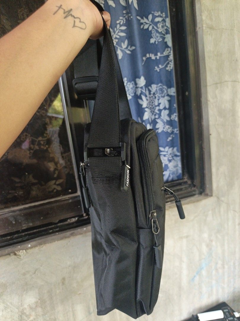 Sling bag for men (Category: Belt bags, Clutches and Pouches) located in Manila. Submitted by ukay-ukaybylyn (Listing ID 1464644767, Image 2). Description: bago pa need laba lang kasi may alikabok medium size na sya kasya long wallet at anik anik mo marami din zip pocket.
