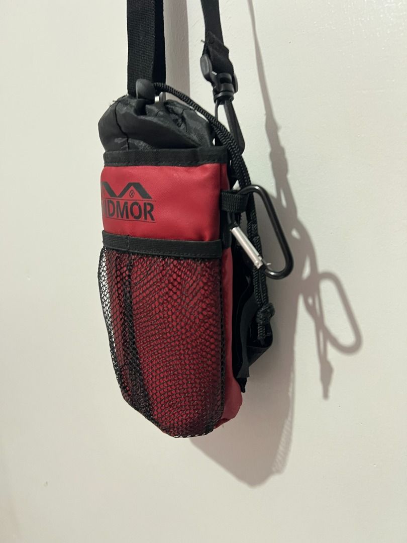SNDM Water Bottle Holder Maroon with Strap (Category: Water Bottles & Tumblers) located in Davao. Submitted by jpnusapasabuyfindsdvo (Listing ID 1464699223, Image 3). Description: - Brand/Model: SNDM Water Bottle Holder - Color: Maroon and black - Material: Durable fabric with quick-drying, breathable mesh body - Closure: Secure drawstring top - Portability: Includes an adjustable black strap and a carabiner clip - Ideal For: Daily walks, hikes, 