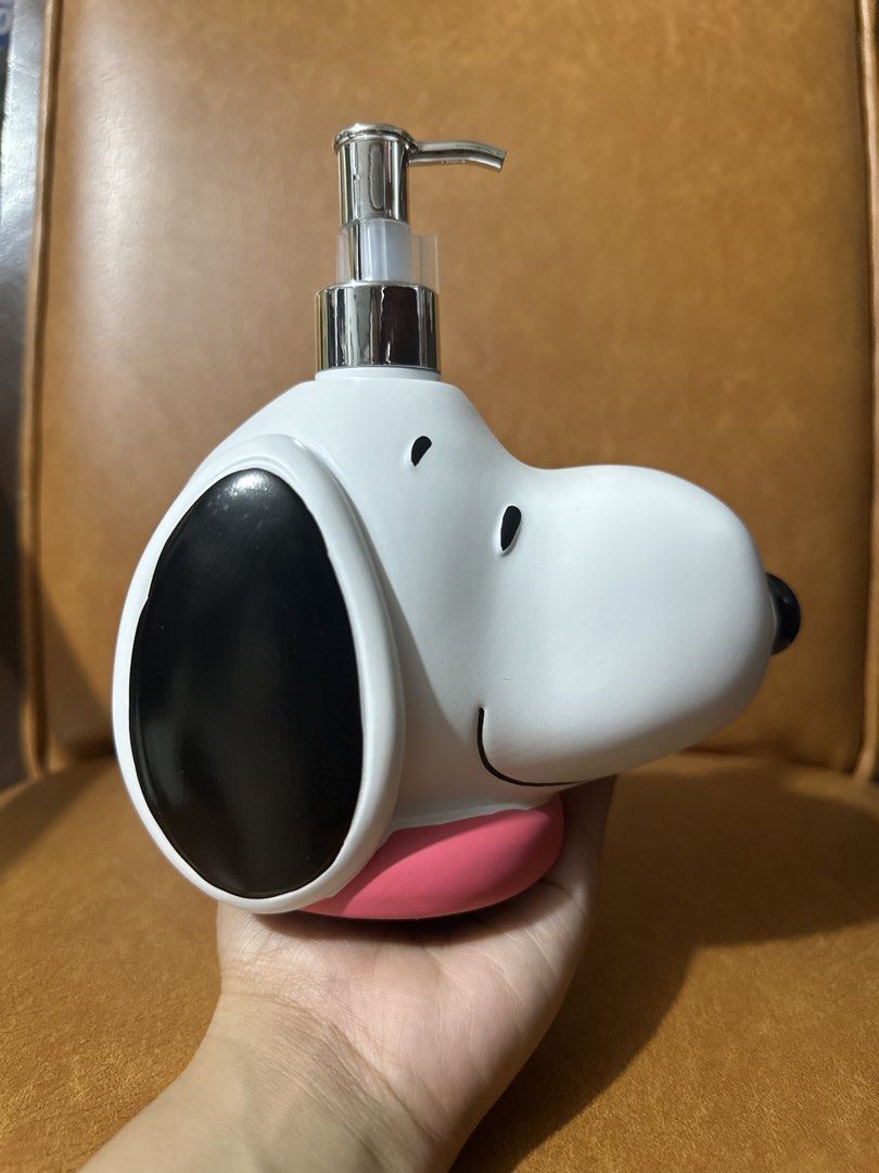 Snoopy Peanuts Soap Dispenser (Category: Character Goods) located in Quezon City. Submitted by oohsahanuhh (Listing ID 1464621136, Image 3). Description: Gcash payment Meet up Sm north edsa or trinoma Delivery: shpee chckout available - Adorable Snoopy head design - White dispenser with classic black ears and eyes - Features a cute pink collar detail - Durable chrome pump for easy dispensing - Ideal for adding a fun touch to your bathroom or kitc