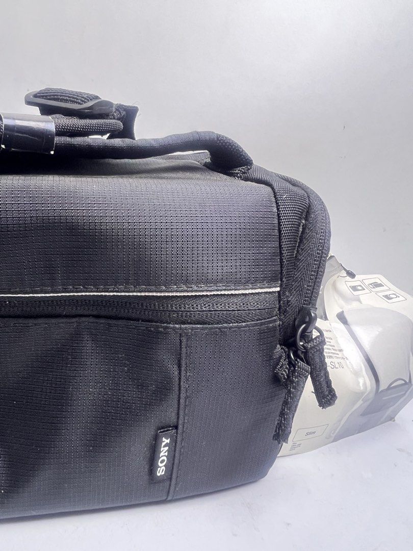 Sony LCS-SL10 Soft Carrying Case (Category: Camera Bags & Carriers) located in Baguio. Submitted by chiechie1234 (Listing ID 1464716396, Image 3). Description: - Authentic Sony LCS-SL10 soft camera case (Black) - Slim shoulder bag design with included strap - Customizable main compartment with adjustable padded dividers - Convenient front zipped pocket for accessories and spare batteries - Handy mesh pocket under the top lid - Durable exterior ma