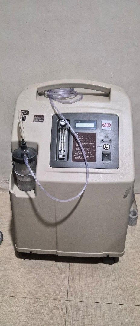 Spirmed SR705F Oxygen Concentrator (Category: Medical Supplies & Tools) located in Quezon City. Submitted by marya_s (Listing ID 1464764726, Image 1). Description: 1 year warranty 115 jours used - Model: Spirimed SR705F medical oxygen concentrator - Complete set: Includes flow meter, humidifier bottle, and connected tubing - Easy to monitor: Built-in digital hour meter tracks total usage time - User-friendly: Simple front panel with power switch 