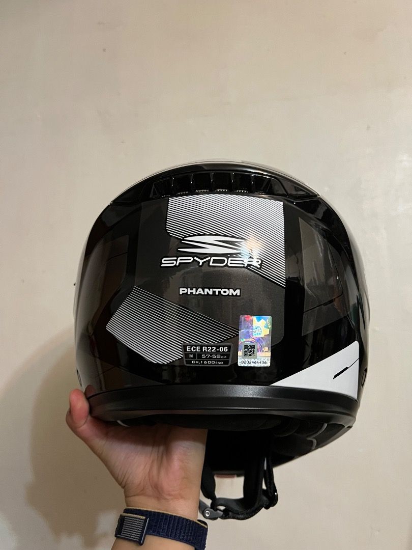 Spyder Phantom Modular Motorcycle Helmet (Category: Helmets and other Riding Gears) located in Caloocan City. Submitted by gnv_09dce0 (Listing ID 1445267766, Image 3). Description: Spyder Phantom Modular Helmet. 🪖 Type: Modular motorcycle helmet with a flip-up portion. Visor: Dual visor system including a clear main visor and a tinted sun shield. Safety: ECE certified with an ICC sticker. Features: Quick-release strap, removable/washable lining,
