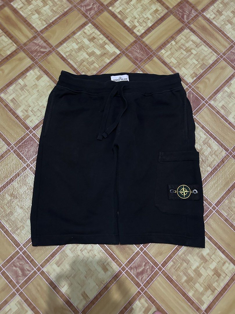 Stone Island Black Cargo Shorts (Category: Shorts) located in Manila. Submitted by livedog-d301 (Listing ID 1464734847, Image 1). Description: - Brand: Stone Island - Color: Black - Material: Premium cotton fleece for maximum comfort - Details: Drawstring waistband, signature compass badge, and side pocket logo patch - Authenticity: Includes Certilogo tag inside - Origin: Made in Romania - Condition: Excellent / Ready to wear.