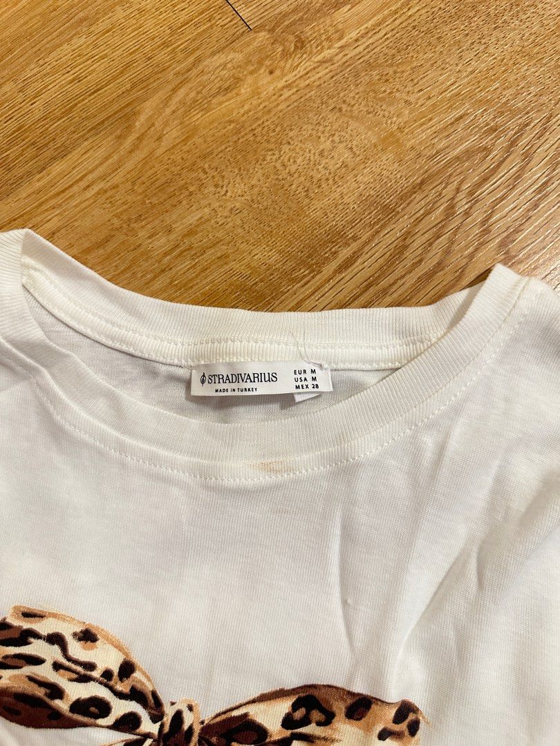 [STRADIVARIUS] leopard bow fitted tee (Category: Shirts) located in Cainta. Submitted by m4tchyyy (Listing ID 1464659569, Image 2). Description: 🍀 mode of payment: gcash or bdo 🍀 mode of delivery: j&t express, ggx, or same day delivery within metro manila feel free to inquire! 🩷.