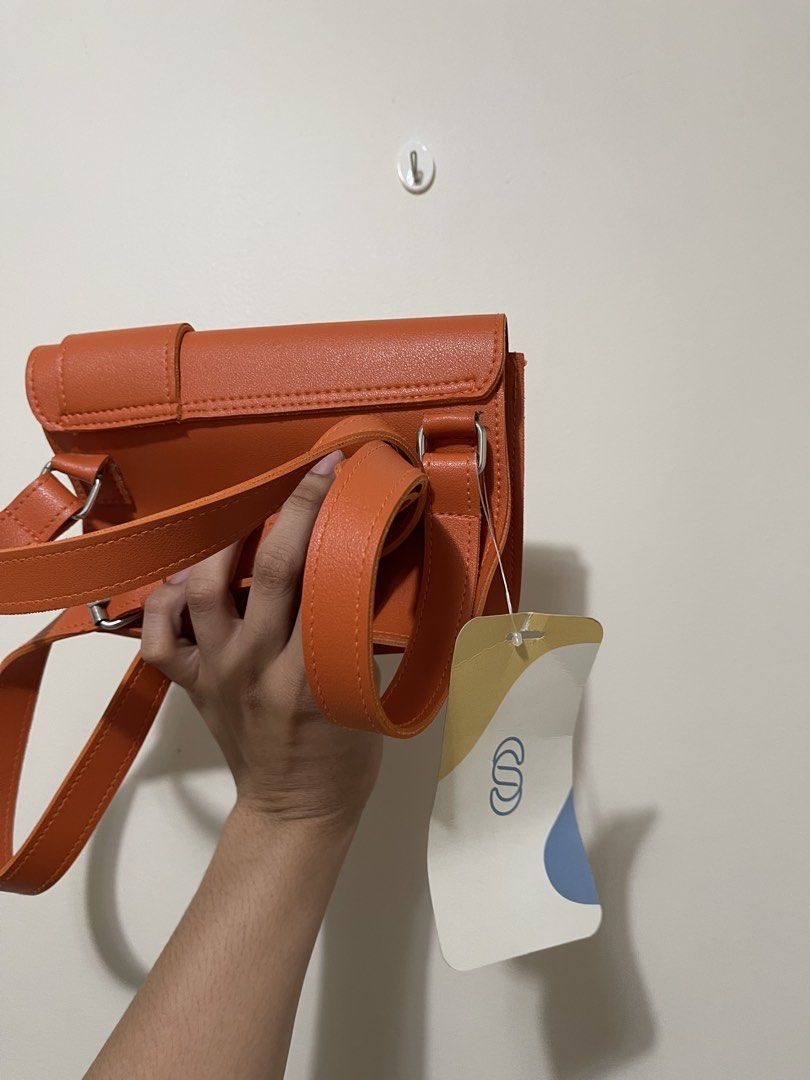 Straightforward Boundless Basics Orange Sling Bag (Category: Cross-body Bags) located in Pasig City. Submitted by gespinosa (Listing ID 1464737287, Image 3). Description: - Brand: Straightforward (Boundless Basics) - Color: Vibrant Orange - Condition: Brand new with original tags attached - Features: Structured flap design, strap loops on the back, clean interior - Inclusion: Adjustable strap included - Perfect for daily use and adding a pop of c