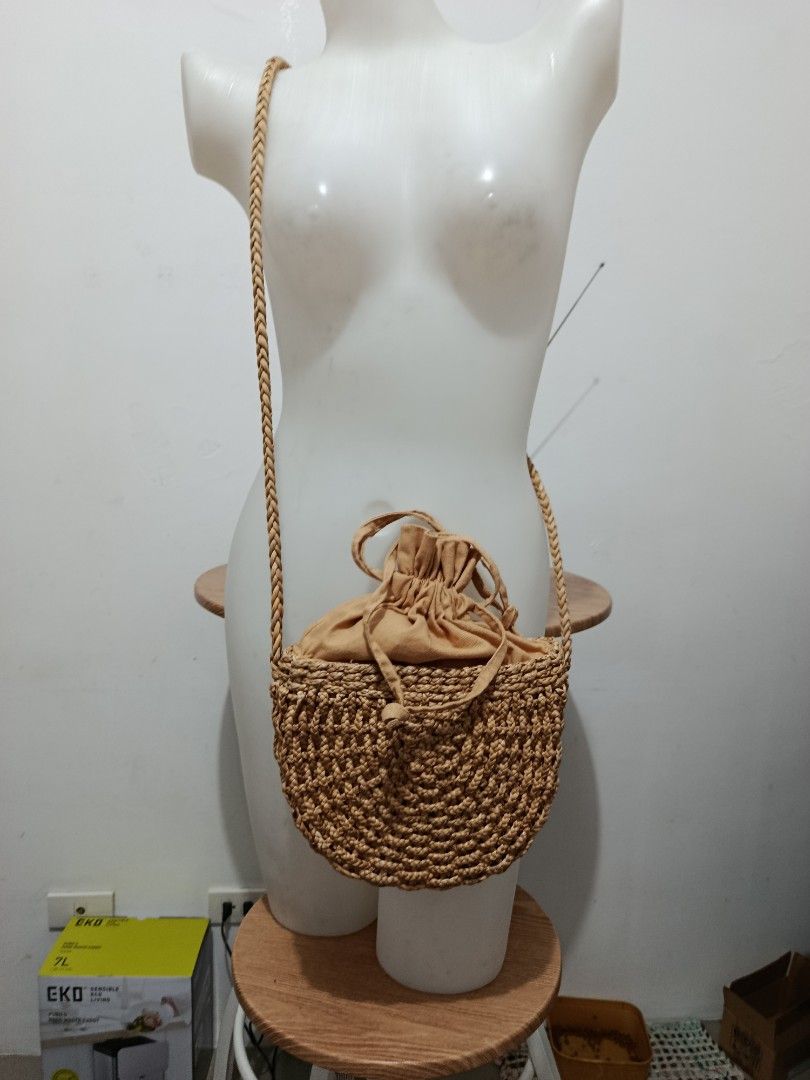 Straw Bucket Bag with Drawstring Closure (Category: Beach Bags) located in Manila. Submitted by beckylafea (Listing ID 1464574756, Image 3). Description: - Cute and stylish straw bucket bag - Made from natural woven material - Features a tan fabric lining with a secure drawstring closure - Comfortable braided strap - Ideal for summer outings, beach trips, or everyday casual wear - Perfectly sized to fit your essentials.